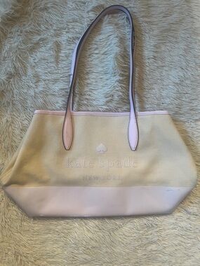 kate spade beige canvas tote with light pink trim and handles